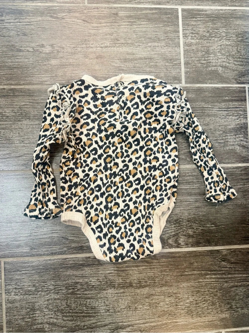 Size 3-6 month leopard onsie…